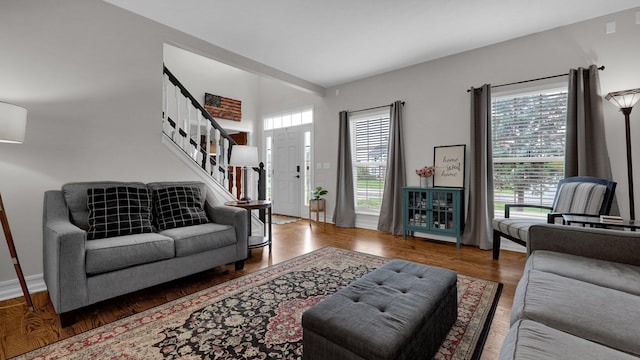 6101 Parkmeadow Ln, Hilliard, OH 43026 - living room featuring stairway, wood finished floors, and baseboards