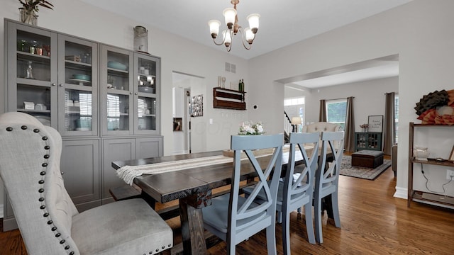 6101 Parkmeadow Ln, Hilliard, OH 43026 - dining space featuring a chandelier and wood finished floors