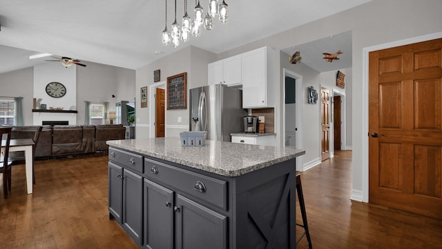 6101 Parkmeadow Ln, Hilliard, OH 43026 - kitchen with stainless steel fridge with ice dispenser, white cabinets, a ceiling fan, a kitchen island, and dark wood-type flooring