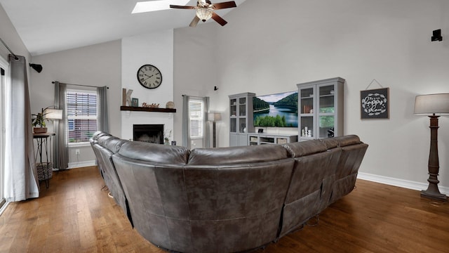 6101 Parkmeadow Ln, Hilliard, OH 43026 - living room with baseboards, a fireplace, high vaulted ceiling, wood finished floors, and ceiling fan