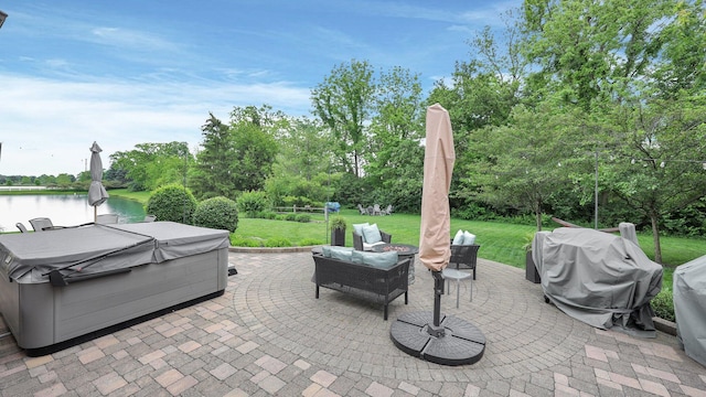 6101 Parkmeadow Ln, Hilliard, OH 43026 - view of patio / terrace with a hot tub, a water view, view of scattered trees, and a grill