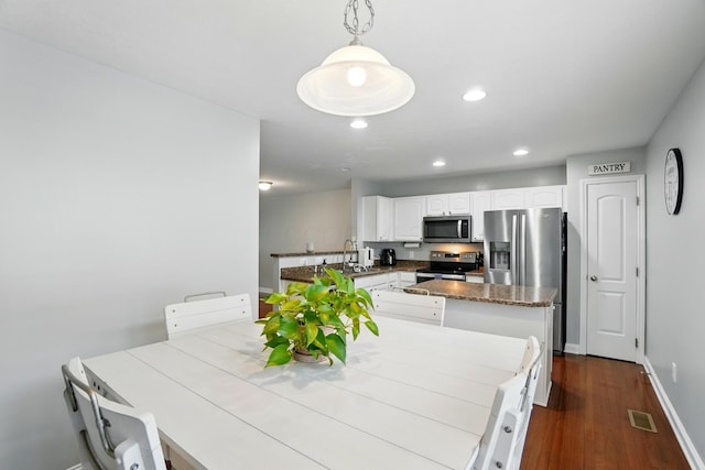 5932 Winberry Creek Dr Unit 1106, Dublin, OH 43016 - dining room with dark wood finished floors, recessed lighting, and baseboards