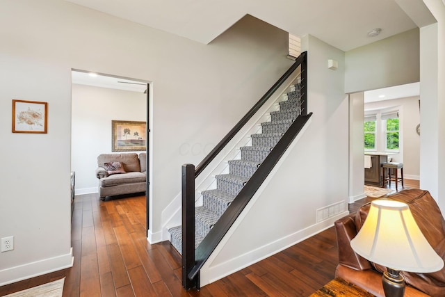 2407 Bryton Dr, Powell, OH 43065 - staircase featuring hardwood / wood-style flooring and baseboards