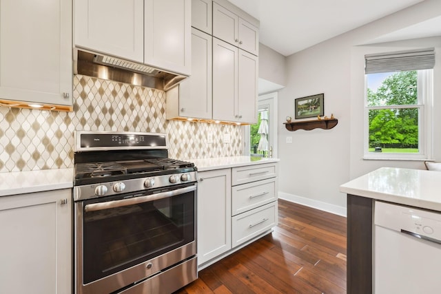 2407 Bryton Dr, Powell, OH 43065 - kitchen featuring stainless steel range with gas stovetop, white dishwasher, range hood, light countertops, and healthy amount of natural light