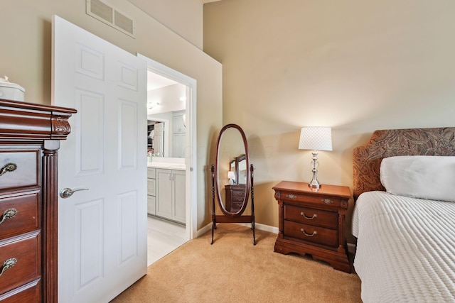 2407 Bryton Dr, Powell, OH 43065 - bedroom featuring light colored carpet, ensuite bathroom, and baseboards
