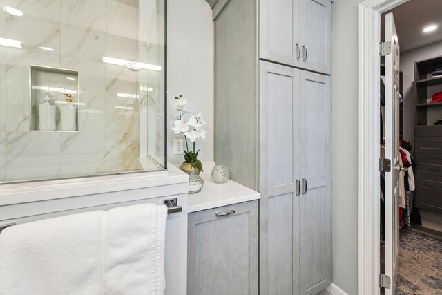 2407 Bryton Dr, Powell, OH 43065 - bathroom with a stall shower, a spacious closet, and vanity