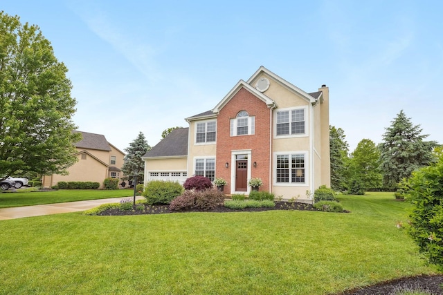 2407 Bryton Dr, Powell, OH 43065 - colonial house with a chimney, a front lawn, a garage, driveway, and stucco siding