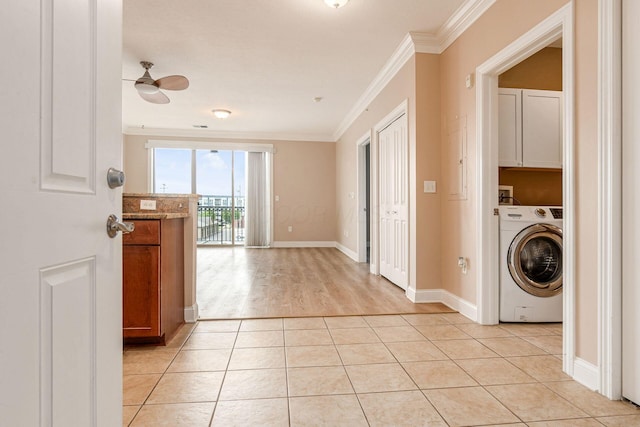 539 W 1st Ave Unit 308, Columbus, OH 43215 - laundry area featuring washer / dryer, cabinet space, crown molding, ceiling fan, and light tile patterned floors