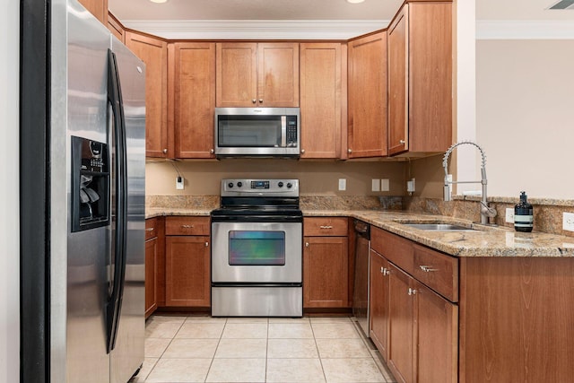 539 W 1st Ave Unit 308, Columbus, OH 43215 - kitchen with stainless steel appliances, crown molding, a sink, brown cabinets, and light stone countertops