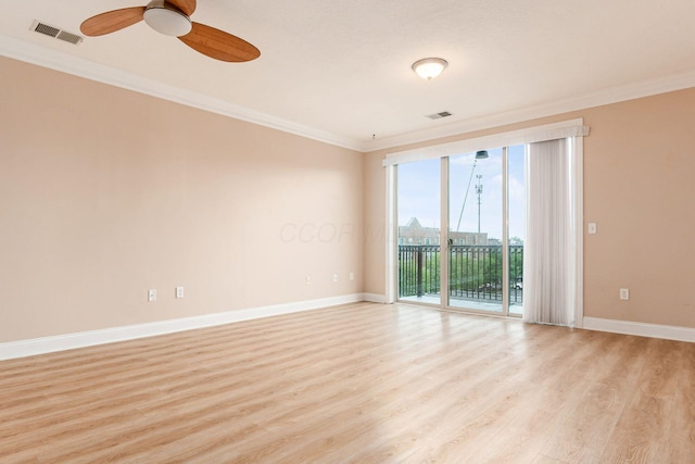 539 W 1st Ave Unit 308, Columbus, OH 43215 - empty room featuring crown molding, light wood finished floors, baseboards, and ceiling fan