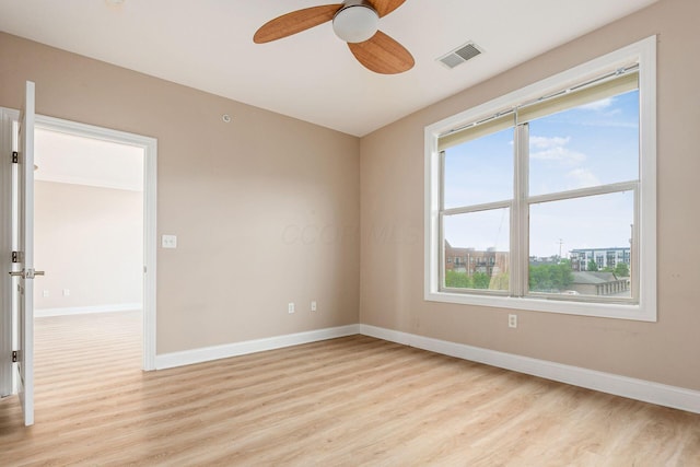 539 W 1st Ave Unit 308, Columbus, OH 43215 - spare room featuring light wood finished floors, baseboards, and ceiling fan