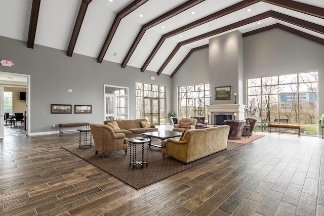 539 W 1st Ave Unit 308, Columbus, OH 43215 - living area with high vaulted ceiling, a fireplace, dark wood-style flooring, beamed ceiling, and recessed lighting