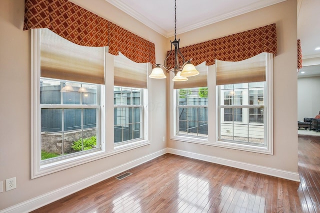 6711 Cooperstone Dr, Dublin, OH 43017 - unfurnished dining area with hardwood / wood-style flooring, baseboards, a chandelier, and ornamental molding