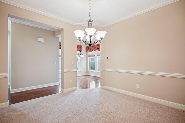 6711 Cooperstone Dr, Dublin, OH 43017 - carpeted empty room with a chandelier, crown molding, and baseboards