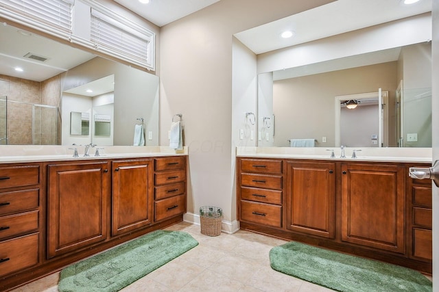 6711 Cooperstone Dr, Dublin, OH 43017 - full bath with a stall shower, two vanities, tile patterned flooring, baseboards, and recessed lighting