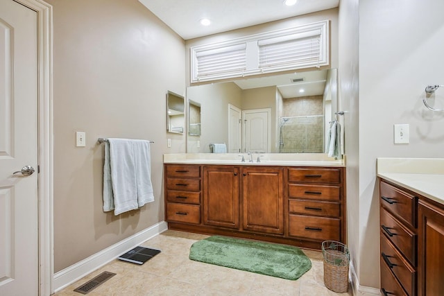 6711 Cooperstone Dr, Dublin, OH 43017 - bathroom featuring vanity, baseboards, a stall shower, tile patterned flooring, and recessed lighting