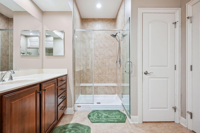 6711 Cooperstone Dr, Dublin, OH 43017 - bathroom featuring a shower stall, vanity, tile patterned flooring, and baseboards