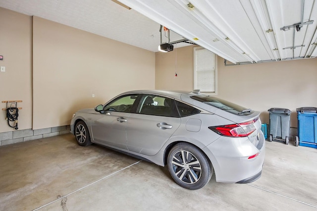 6711 Cooperstone Dr, Dublin, OH 43017 - garage featuring a garage door opener