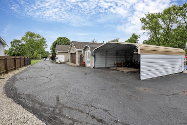 942 Mount Vernon Rd, Newark, OH 43055 - view of front of house with a carport and an outbuilding