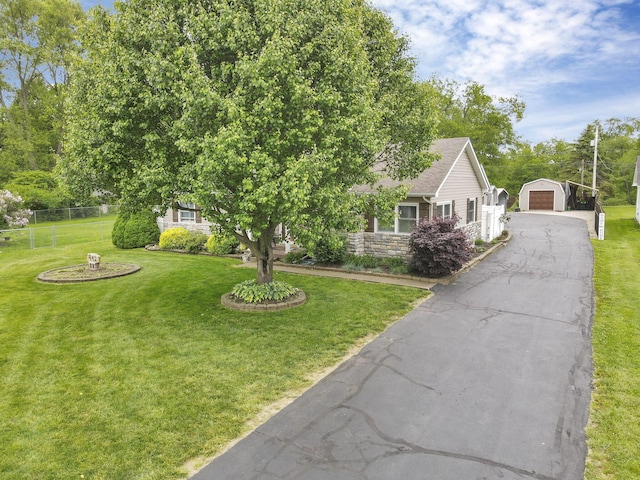 942 Mount Vernon Rd, Newark, OH 43055 - view of front of house featuring a garage, an outbuilding, and asphalt driveway
