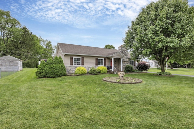 942 Mount Vernon Rd, Newark, OH 43055 - view of front of house with stone siding, a front yard, and a chimney