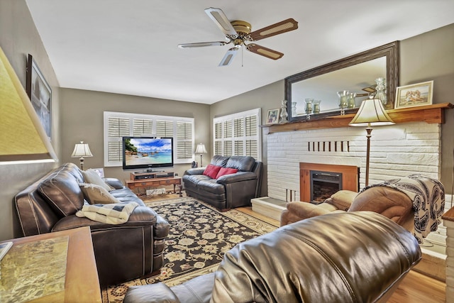 942 Mount Vernon Rd, Newark, OH 43055 - living area featuring wood finished floors, a ceiling fan, and a brick fireplace