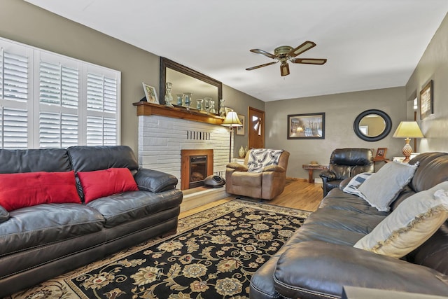 942 Mount Vernon Rd, Newark, OH 43055 - living room featuring ceiling fan, a brick fireplace, and wood finished floors