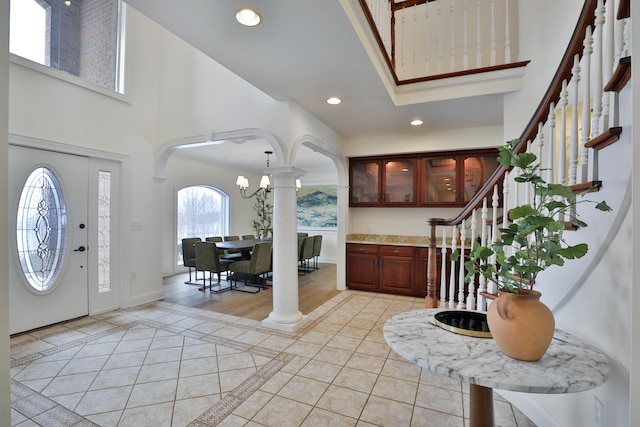 2300 Stonewall Cemetery Rd SW, Lancaster, OH 43130 - entrance foyer featuring a towering ceiling, light tile patterned floors, stairs, arched walkways, and recessed lighting