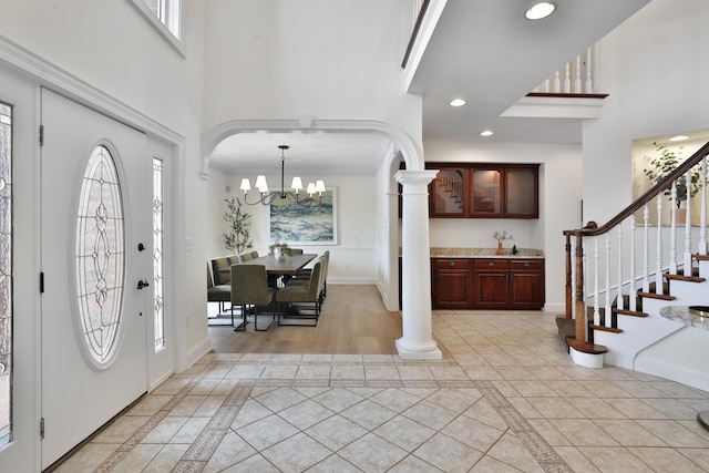 2300 Stonewall Cemetery Rd SW, Lancaster, OH 43130 - foyer with inlaid floor details, a high ceiling, ornate columns, baseboards, and stairway