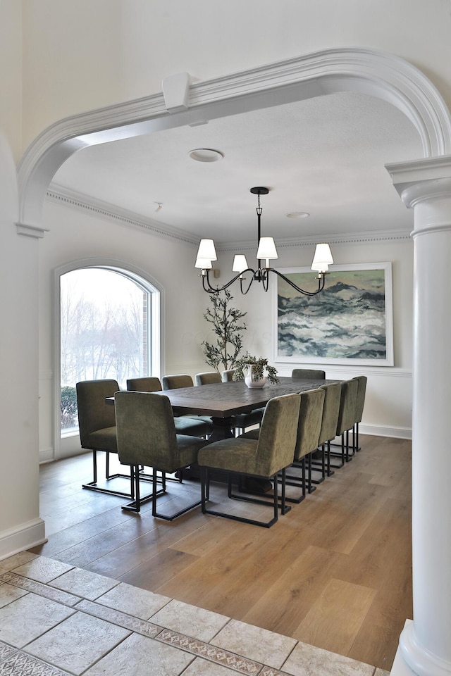2300 Stonewall Cemetery Rd SW, Lancaster, OH 43130 - dining space featuring ornate columns, ornamental molding, arched walkways, and baseboards
