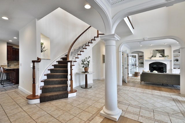 2300 Stonewall Cemetery Rd SW, Lancaster, OH 43130 - entryway with decorative columns, light tile patterned flooring, recessed lighting, a towering ceiling, and arched walkways