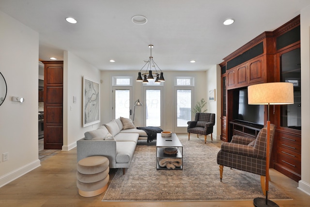 2300 Stonewall Cemetery Rd SW, Lancaster, OH 43130 - living room with recessed lighting, baseboards, a chandelier, and light wood-type flooring