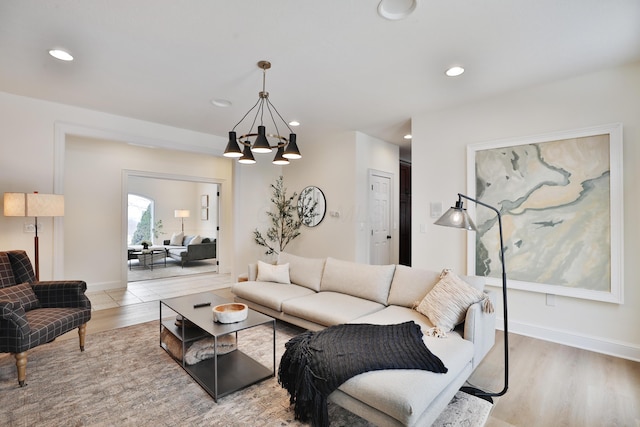 2300 Stonewall Cemetery Rd SW, Lancaster, OH 43130 - living room featuring a chandelier, recessed lighting, light wood-type flooring, and baseboards
