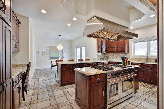 2300 Stonewall Cemetery Rd SW, Lancaster, OH 43130 - kitchen featuring range with two ovens, island exhaust hood, recessed lighting, a kitchen island, and decorative backsplash