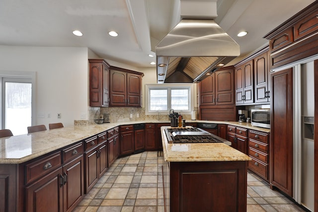 2300 Stonewall Cemetery Rd SW, Lancaster, OH 43130 - kitchen with paneled built in refrigerator, stainless steel microwave, decorative backsplash, stovetop, and a peninsula