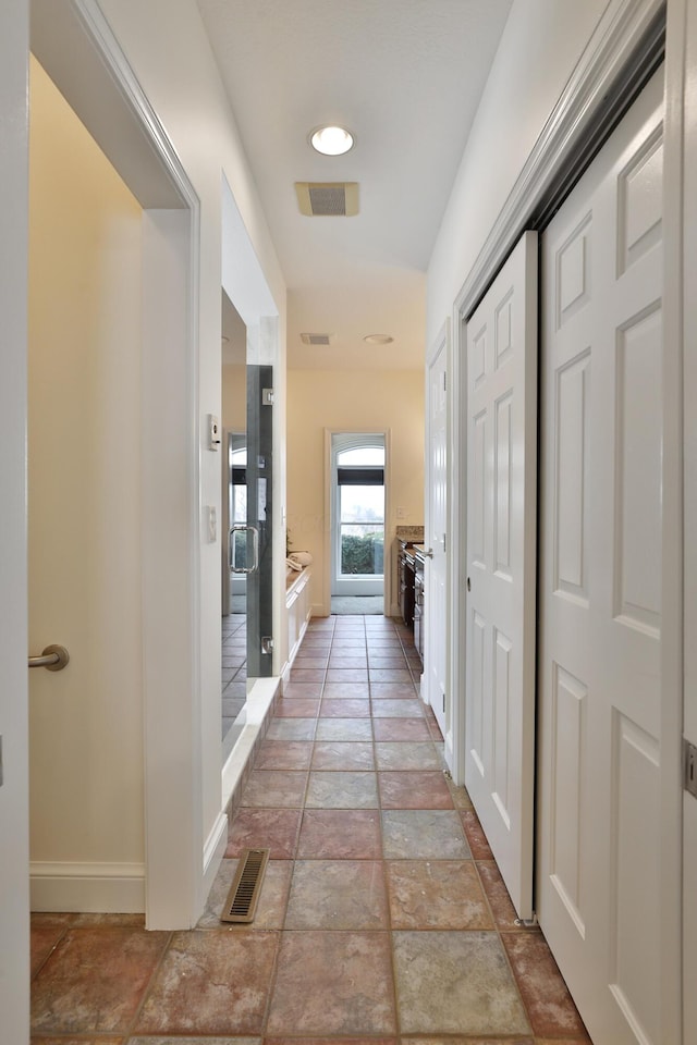 2300 Stonewall Cemetery Rd SW, Lancaster, OH 43130 - hall with baseboards and light stone finish floors