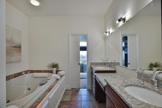 2300 Stonewall Cemetery Rd SW, Lancaster, OH 43130 - bathroom with double vanity, a whirlpool tub, and tile patterned floors