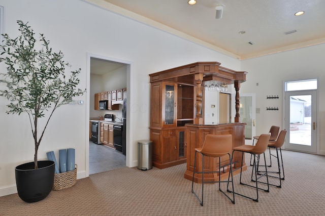 2300 Stonewall Cemetery Rd SW, Lancaster, OH 43130 - dining area featuring light carpet, recessed lighting, bar area, and baseboards