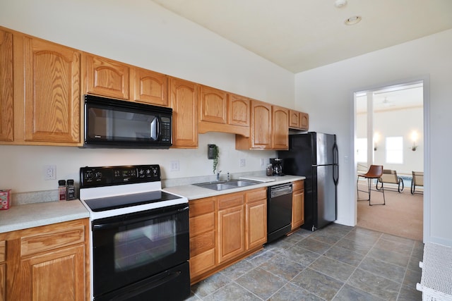 2300 Stonewall Cemetery Rd SW, Lancaster, OH 43130 - kitchen featuring black appliances, a sink, light countertops, and dark carpet