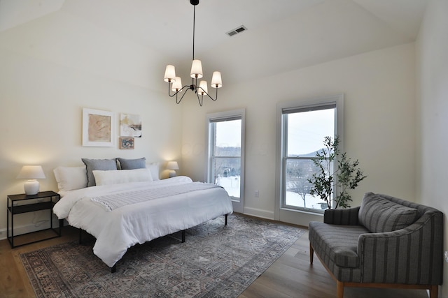 2300 Stonewall Cemetery Rd SW, Lancaster, OH 43130 - bedroom featuring a chandelier, wood finished floors, and baseboards