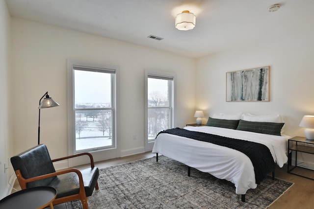 2300 Stonewall Cemetery Rd SW, Lancaster, OH 43130 - bedroom featuring wood finished floors and multiple windows