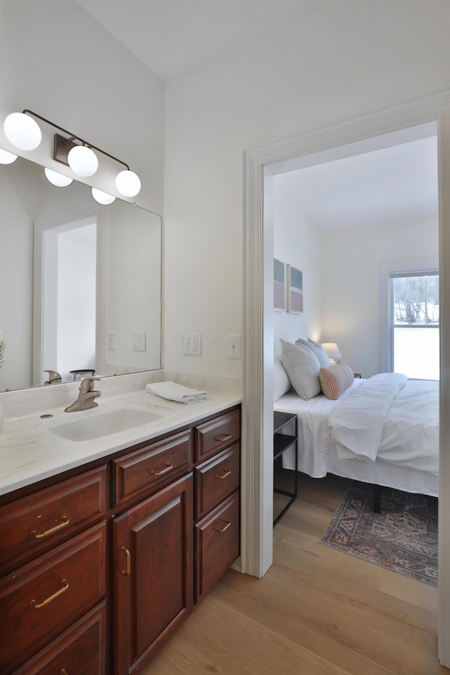 2300 Stonewall Cemetery Rd SW, Lancaster, OH 43130 - bathroom with wood finished floors and vanity