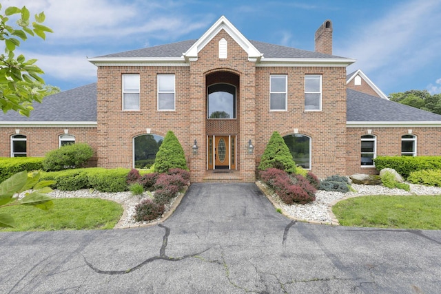 2300 Stonewall Cemetery Rd SW, Lancaster, OH 43130 - view of front facade featuring a chimney, brick siding, and a shingled roof
