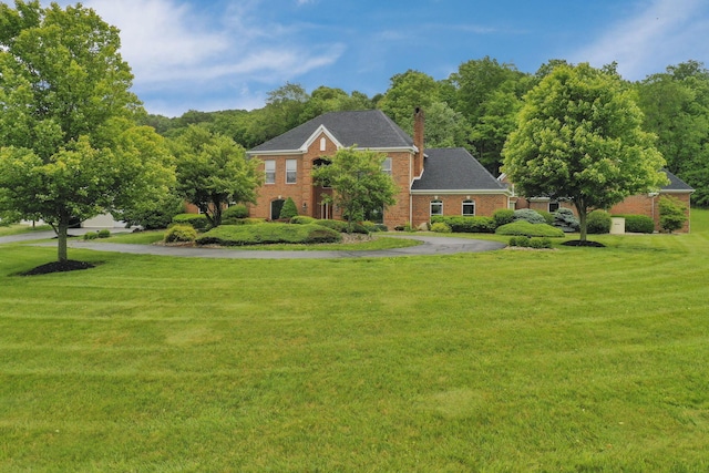 2300 Stonewall Cemetery Rd SW, Lancaster, OH 43130 - view of front of property with a front yard, a chimney, and brick siding