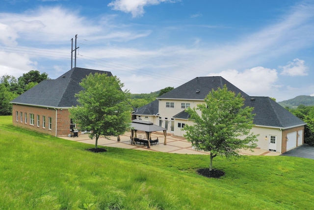 2300 Stonewall Cemetery Rd SW, Lancaster, OH 43130 - rear view of property with a gazebo, a patio area, and a yard