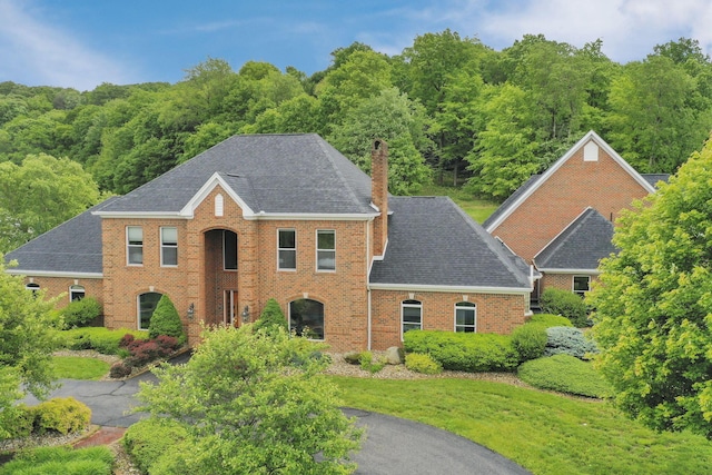 2300 Stonewall Cemetery Rd SW, Lancaster, OH 43130 - view of front facade with a chimney, brick siding, and a shingled roof