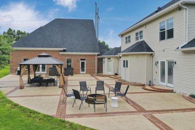 2300 Stonewall Cemetery Rd SW, Lancaster, OH 43130 - back of house featuring a gazebo, a patio, roof with shingles, and brick siding