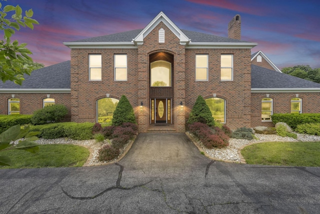 2300 Stonewall Cemetery Rd SW, Lancaster, OH 43130 - view of front of home with a shingled roof, a chimney, and brick siding