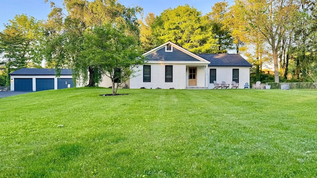 5210 Chevy Chase Ct, Columbus, OH 43220 - view of front of house with an outdoor structure, a front yard, and asphalt driveway