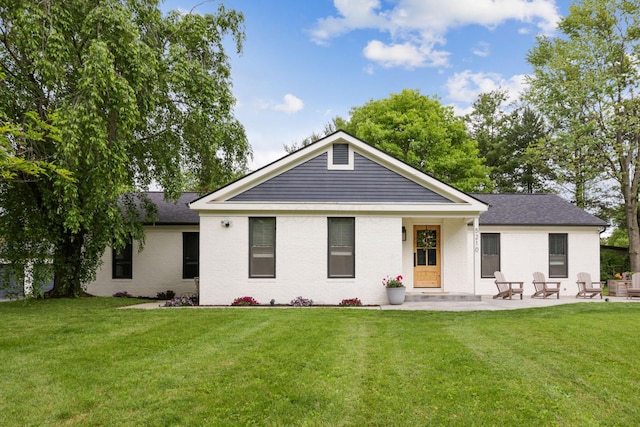 5210 Chevy Chase Ct, Columbus, OH 43220 - back of house with a yard, brick siding, and a patio area